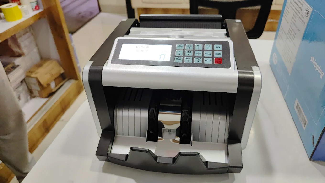 Retail counter using a billing machine and barcode scanner supplied by Space Tech Enterprises in Indore